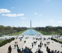 Image of the washington monument and field with people